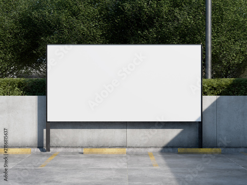 Blank advertising billboard mockup on street with concrete and green hedge