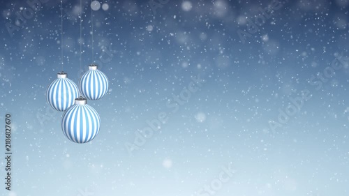 Loop swinging baubles on winter snowfall blue day sky light copy space animation background.