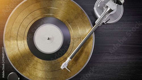 Golden vinyl record on modern turntable.