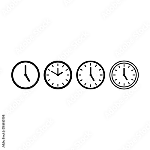Four analog clocks with different times on white background