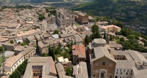 High angle view of the historic center of Orvieto, in the province of Terni, in Umbria, Central Italy, with the Gothic cathedral among the medieval rooftops of the town.