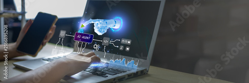 Human interacting with AI agent and robotic automation on a laptop. Represents human AI collaboration, intelligent workflow, digital automation, data processing and future business technology.