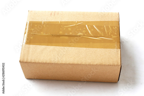 Brown cardboard box sealed with brown packing tape