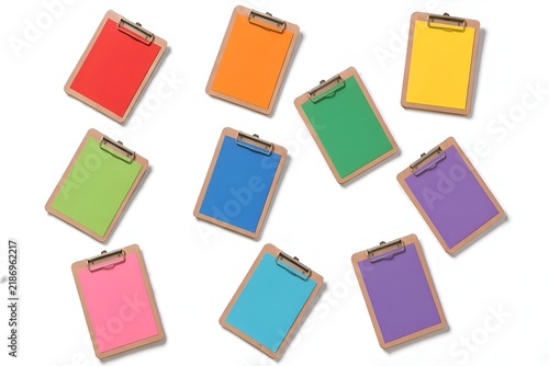 Colorful blank clipboard collection isolated on a white background, featuring pastel and vibrant colored paper sheets with metal clips. Clean minimal composition for office, business, planning and sta