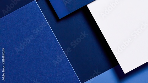 Abstract Geometric Composition of Blue and White Paper Layers.