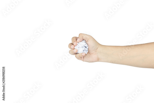фотографія Human hand crushing a crumpled paper ball isolated on white background with clipping path