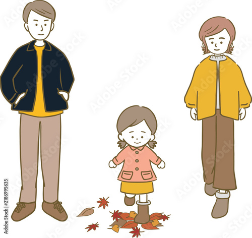 秋の紅葉を楽しむ女の子の3人家族