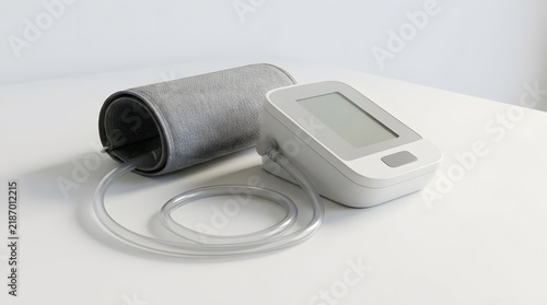 Blood Pressure Monitor and Electronic Sphygmomanometer Device on White Table Surface