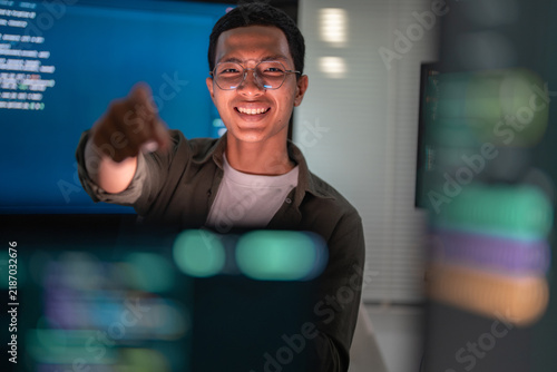 Confident Software Developer Presenting Artificial Intelligence Interface.