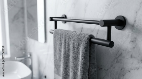 Sleek stainless steel towel rack in matte black for a contemporary bathroom interior