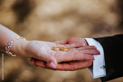 Golden wedding rings in hand