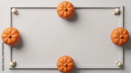 Halloween pumpkins and skulls framed flat lay on neutral background, spooky banner design with copy space