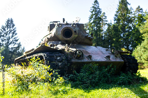 a old tank with a pointing gun