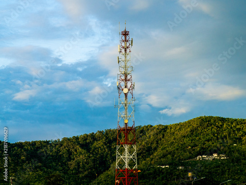 Telecommunications Tower Above Tropical Jungle Covered Hillside