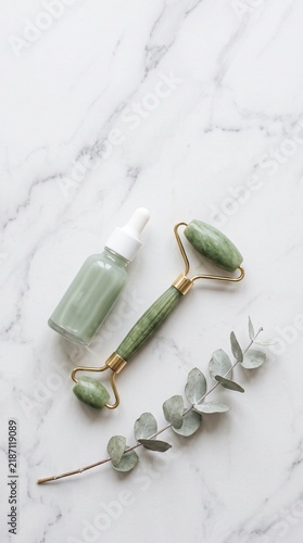 Skincare routine items on marble surface