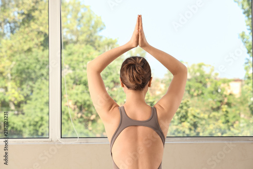 Mindfulness and mental health, woman practicing yoga and meditation with hand...