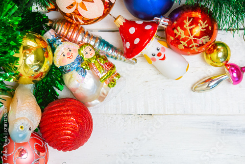 Canvastavla Colorful Christmas decorations arranged on a wooden surface with various ornamen
