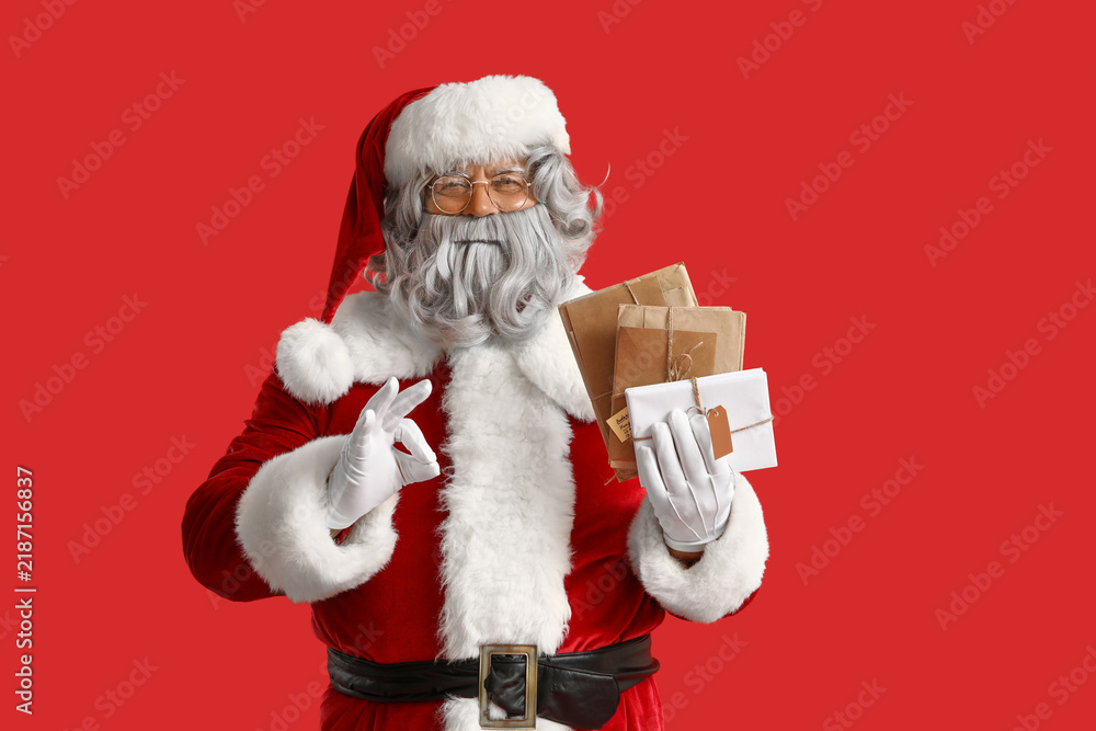 Fototapeta premium Santa Claus with letters on red background