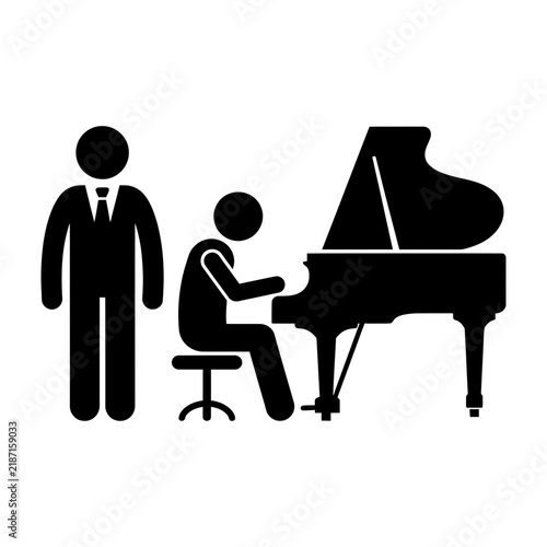 Pianist playing grand piano with audience or accompanist listening attentively nearby