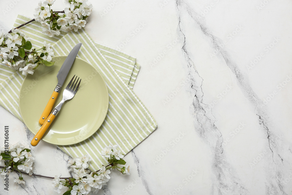 Obraz premium Beautiful table setting with blooming branches on white background
