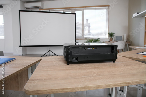 Video projector on table in classroom
