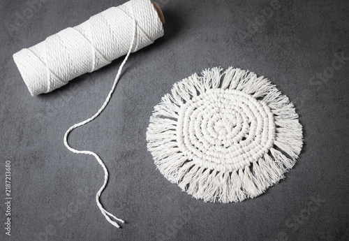 Bild auf Leinwand White macrame decorative item with fringe details, finished handicraft