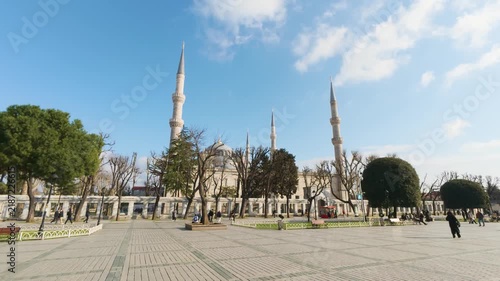ISTANBUL, TURKEY - APRIL 11, 2026: Fast motion video of people walking in front of the historic Blue Mosque in Sultanahmet Square under a clear sunny sky on April 11, 2026.