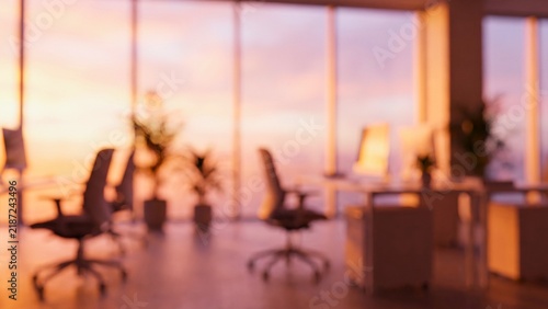 Blurred modern open plan office at sunset abstract background with flowing shapes and lines