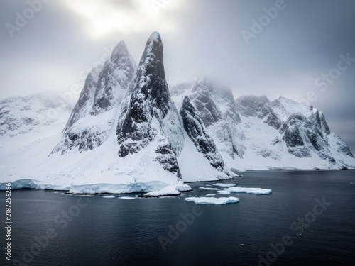 Snowy arctic peaks over water