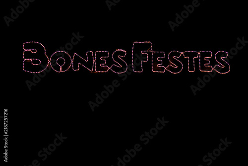 Bild auf Leinwand Catalan Christmas greeting reading “Bones Festes” with festive lights on a dark