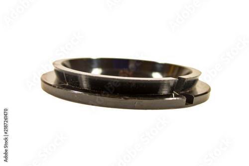Obraz na płótnie Circular microscope stage component with metal ring, central mounting point and recessed rotating mechanism, isolated on a white background