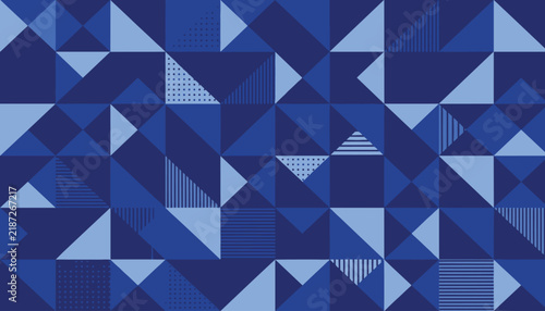 Abstract blue geometric pattern consisting of overlapping triangles, stripes, and dots in shades of navy and sky blue.