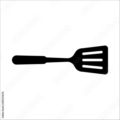 Obraz na plátně Black silhouette of a cooking spatula with slotted head for flipping food on grill or pan
