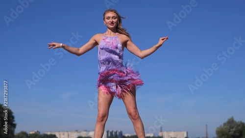Young Tanned Model Enjoying Outdoor Summer Vacation Beside The River. Dancing And Relaxing In The Warm Sun.