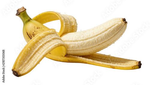 Canvas Print Partially peeled ripe yellow banana with brown spots, isolated on transparent ba