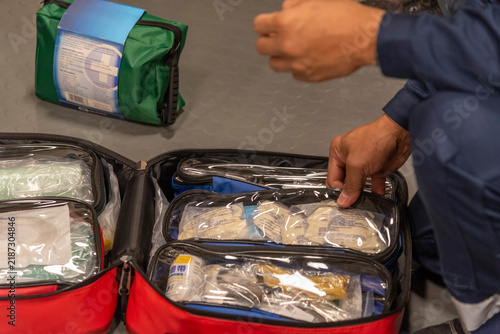 Картината върху платно Standard first aid equipment prepared for inspection and demonstration during a shipboard safety exercise, highlighting emergency response and crew training aboard a commercial vessel