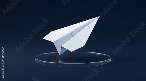 White paper airplane floating above a clear circular acrylic display stand with wallpaper backgrond