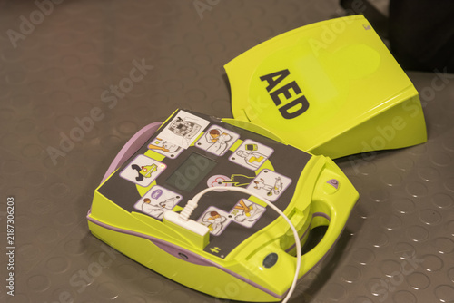 Obraz na plátne Automated external defibrillator set up for a simulated medical emergency during shipboard crew training, emphasizing first aid, resuscitation and lifesaving equipment