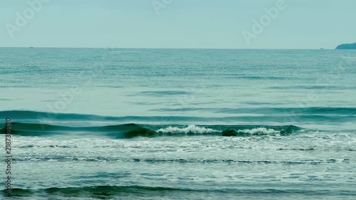 Peaceful blue ocean horizon background on a bright sunny day
