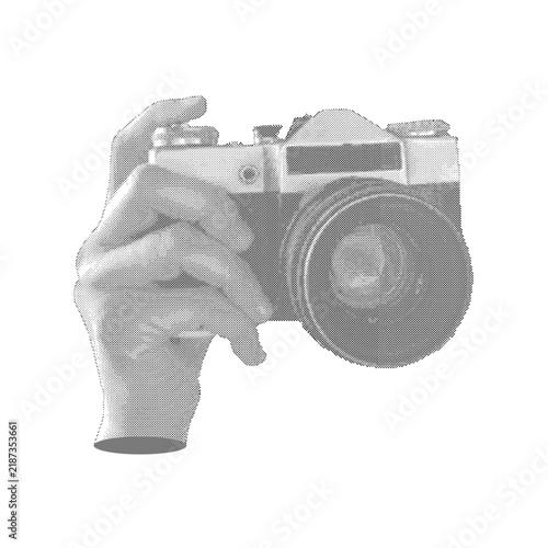 Hand holding analog photo camera