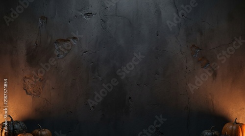 Grunge concrete wall texture with dark pumpkins and warm orange glow, halloween background with copy space