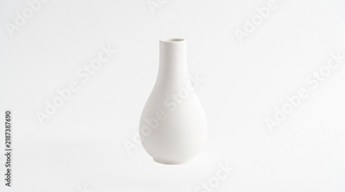 Minimalist matte white ceramic vase with a slender neck and bulbous body isolated on a clean white background