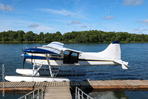 Small float plane designed to fly in remote Alaska bush takes off and lands on Alaskan river water for adventure.