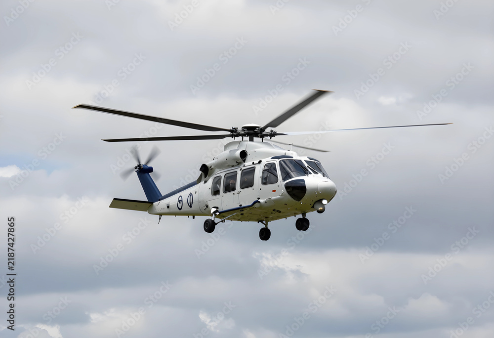 Fototapeta premium Emergency medical services and search and rescue helicopter, modern aircraft in flight for rapid response and disaster relief operations in cloudy sky