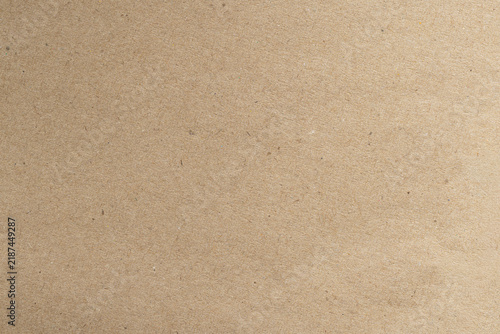 Fotografie Recycled Natural Brown Kraft Paper Texture Background,Macro,A high-resolution top-down macro photograph of a natural brown kraft paper sheet texture showing fine organic fibers and subtle flecks