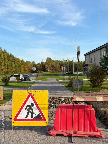 carrying out repair work on the street in front of a building or a public building