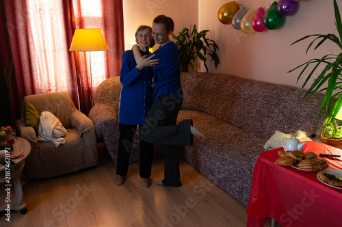 Mother and daughter dancing happily