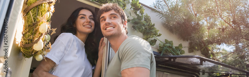 Принти на полотні Happy couple enjoying a cozy weekend escape in their camping van, banner