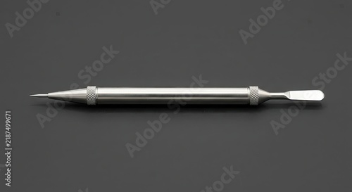 Stainless steel double-ended dental or sculpting tool.