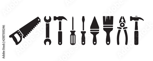 Manual construction tools set containing hammer screwdriver saw wrench pliers and brush design.